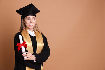 Happy student with diploma after graduation on beige background. Space for text
