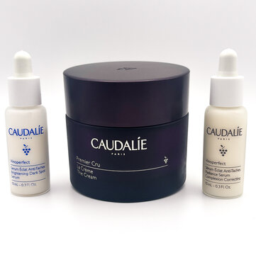 Caudalie Vinoperfect serums and Premier Cru cream arranged on a white background. Miami, FL, May 2025.