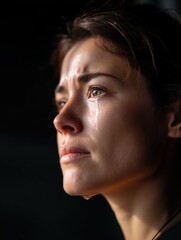 Tear-Streaked Face Lit Dramatically in the Dark