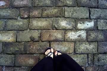 An immersive look at a walk in the Zemun district of Belgrade, Serbia: top view of female feet in...