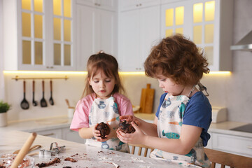 Cooking recipe. Little children making dough for cookies at table in kitchen