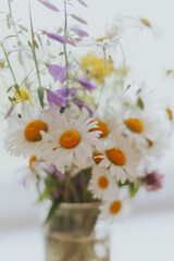 a bouquet of wild flowers and daisies