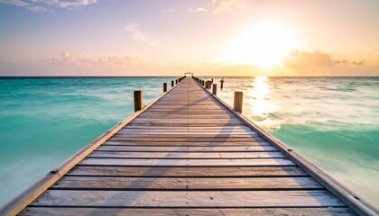 Obraz premium muelle de madera que se extiende directamente hacia el horizonte, sumergiéndose en un mar de un llamativo color turquesa.