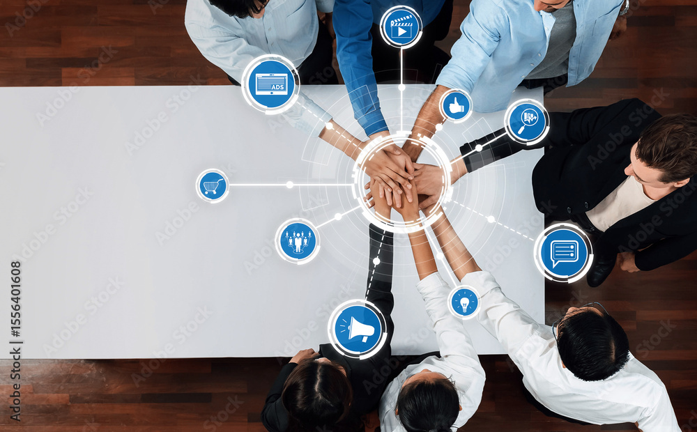 Poster aerial view of a diverse group of professionals with hands united, representing teamwork and collabo
