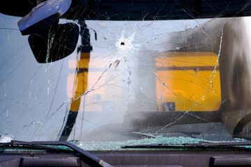 Car windshield with circular crack viewed from inside