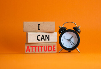 I Can Attitude symbol. Wooden blocks with words I Can Attitude. Beautiful orange background with...