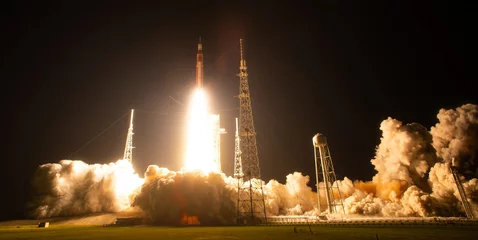 Fotobehang Nasa NASA’s Space Launch System (SLS) rocket with Orion spacecraft aboard lifts off from Launch Pad 39B at Kennedy Space Center for the Artemis I mission. Image courtesy of NASA  © Bluee