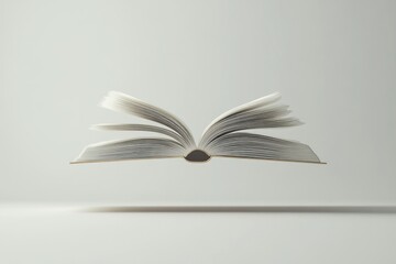 Open book floating on white background with pages turning, suggesting learning, knowledge, and imagination