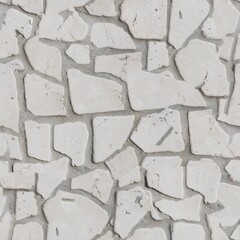 Close-up of a white stone mosaic texture. Irregular white stones form a mosaic pattern, set in a gray mortar background. seamless