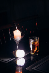 Power outage. Romance. A candle and a battery-powered lamp are on the table.