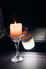 Power outage. Romance. A candle and a battery-powered lamp are on the table.