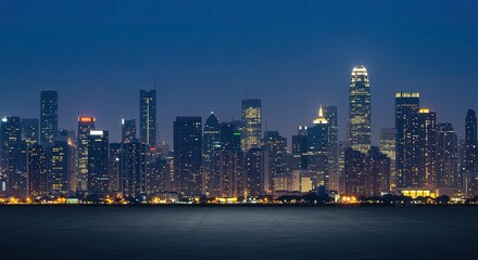 Fototapeta premium Cityscape skyline at night aerial view of urban buildings and skyscrapers illuminated with lights
