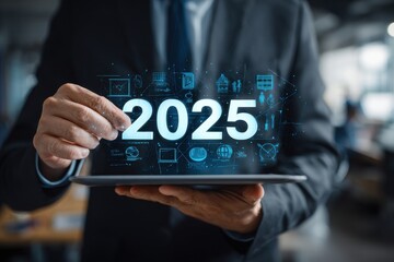 Businessman using a tablet and a digital virtual screen with the text "2025" on a hologram icon for a business plan, goal, mind map