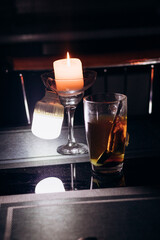 Power outage. Romance. A candle and a battery-powered lamp are on the table.