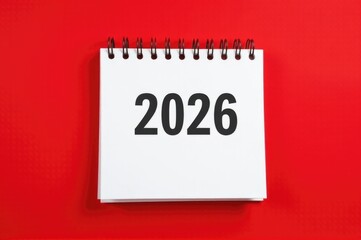 A close-up of a spiral notebook with the year 2026 written on it, suitable for use as a creative prompt or inspiration quote..New Year 2026.