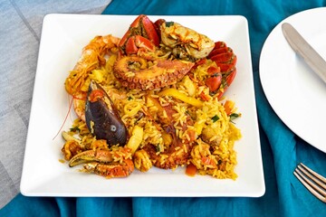 Traditional seafood paella with a variety of selected seafood. Refined and gourmet cuisine