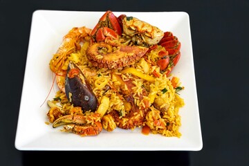 Traditional seafood paella with a variety of selected seafood. Refined and gourmet cuisine