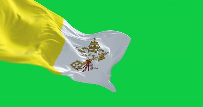 Flag of Vatican City waving in the wind isolated on green background