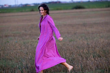 Young Woman's Dance of Freedom in Windy Fields: The Harmony of Femininity and Freedom