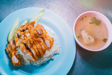 Kao Mun Kai Thaifood. Freshly Prepared Crispy Chicken Rice Served with Clear Soup and Fresh Cucumber Slices