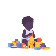 little boy playing with puzzle