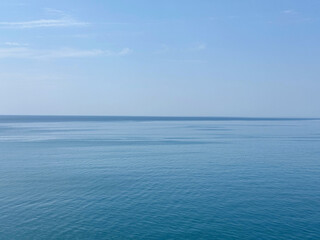 Sea light blue waters and clear sky.