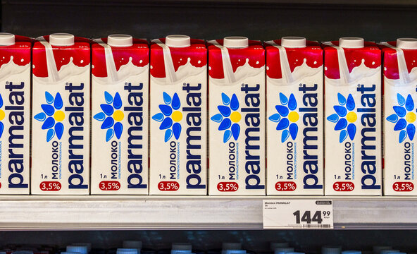 Parmalat milk cartons neatly arranged on supermarket shelf, showcasing branding and product details, ideal for food and beverage marketing. Moscow, Russian Federation.