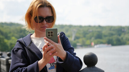 Close-up of a young woman with a phone11
