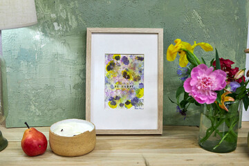 Framed botanical print with 'Be Happy' text displayed in cozy interior – natural flower pigments,...