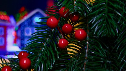 In the middle of a decorated Christmas wreath there are rotating houses with a Christmas tree in the middle - Powered by Adobe