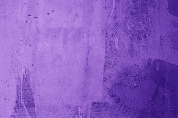 Textured purple old street wall with in different purple shades
