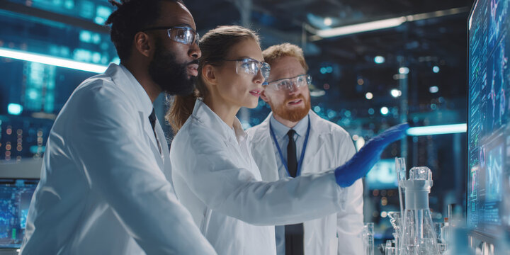 Collaborative Scientific Breakthrough: Diverse Team of Experts Analyzing Complex Data on Advanced Digital Screens in a Modern Research Facility.