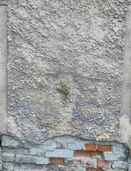 Texture - Old deteriorated brick house facade