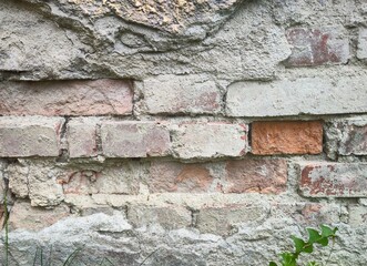 Texture - Old deteriorated brick house facade
