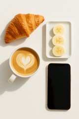 Croissant and coffee breakfast flatlay on white table for cozy morning vibe
