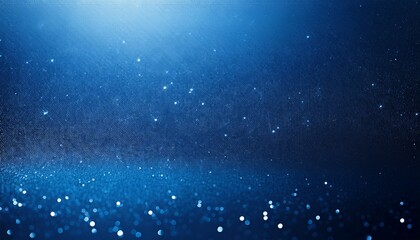 a rich deep blue background with a subtle sparkling texture of fine particles the smooth gradient and shimmering light evoke a sense of depth and elegance