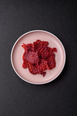 Jerky or dried chicken and cherry snacks. Dehydrated, dried snacks for beer