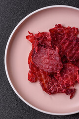 Jerky or dried chicken and cherry snacks. Dehydrated, dried snacks for beer