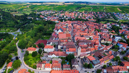 Aerial view around the old town in the city Volkach, 97332 on an sunny spring day in Germany