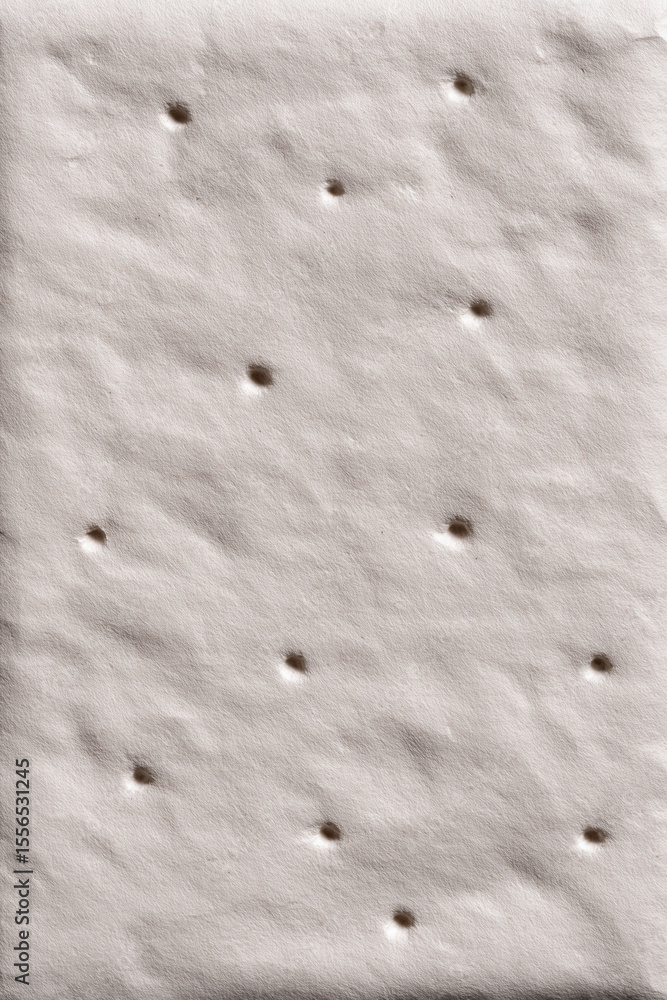 Poster flat surface with multiple holes presented at a close angle for observation and analysis