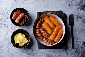 Fried sausages with spicy tomato sauce teokbokki, tokpokki in a bowl