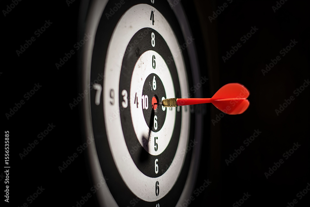 Poster precision target achievement a red dart hitting the bullseye on a dartboard for business success and