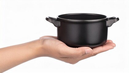 hand holding black pot isolated on white background