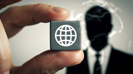 A hand holds a cube with a world icon; a suited figure and world map are subtly visible in the backdrop - Powered by Adobe
