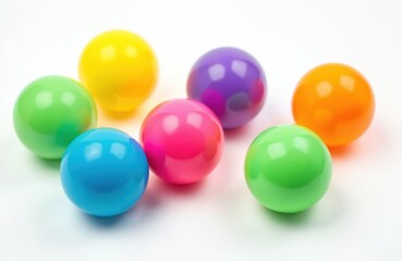 Colorful plastic balls isolated on white background. Bright, round, playful toys in many colors green, blue, yellow, pink, purple, orange. Balls for kids fun game indoors or outdoors.
