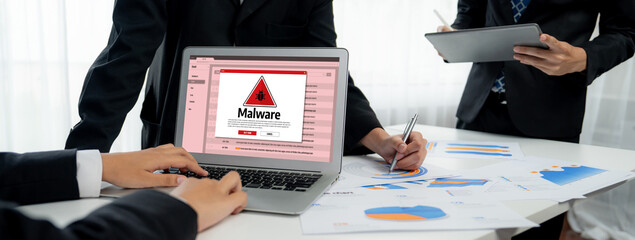 Cyber attacking concept. Malware alert showing on computer screen display scam and threat detection...