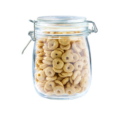 glass jar with whole grain cereal rings isolated on a white background.