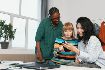 young adult coworkers socializing and working together in a modern workplace with business focus...