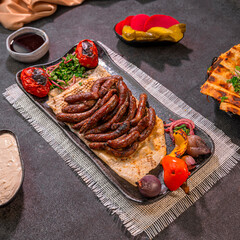 Syrian Sujuk Plate with Tomatoes and Pita Bread
