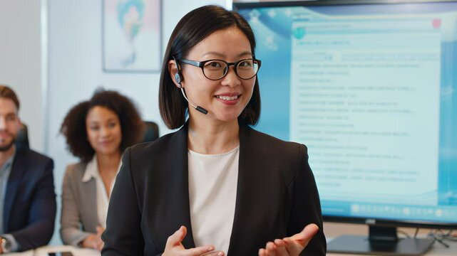 Asian woman speaking to camera with mic in office, two coworkers behind &ndash; AI generative model